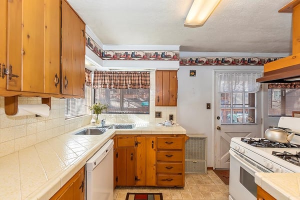 Kitchen Area with Access to the Back Deck and Spa