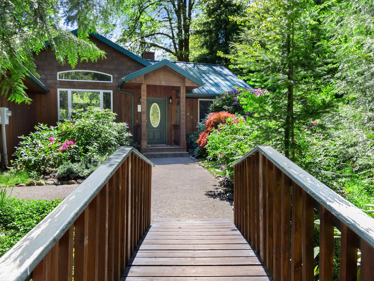 Little bridge over creek to front door