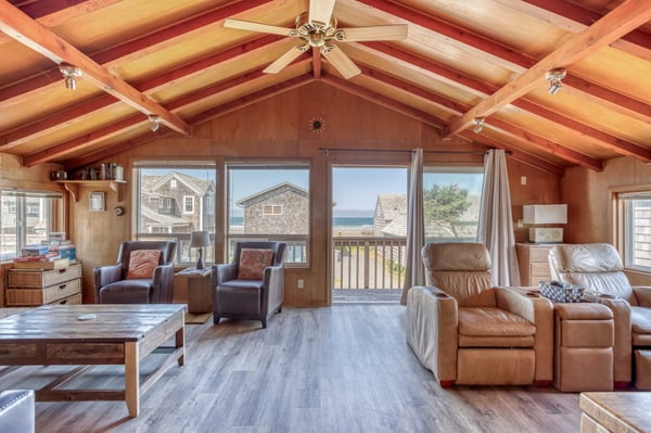 Lounge Room with Seating and Balcony View