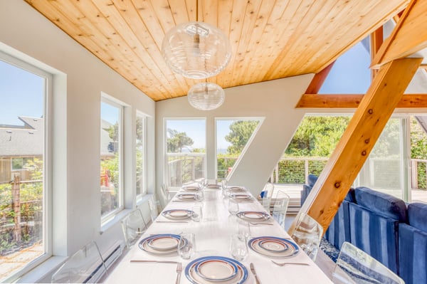 Large open windows with natural sunlight while dining