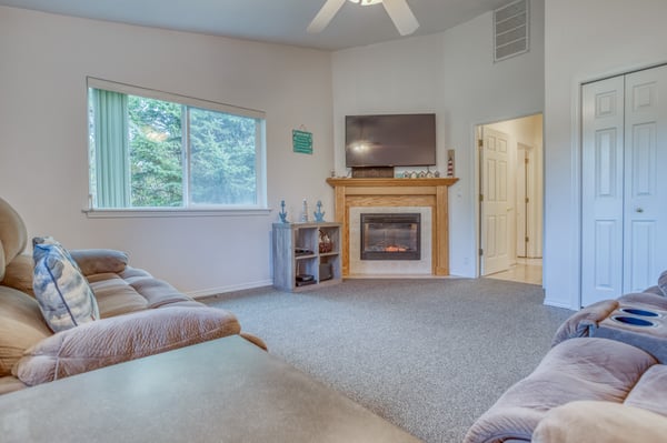 Living Room with fireplace & television