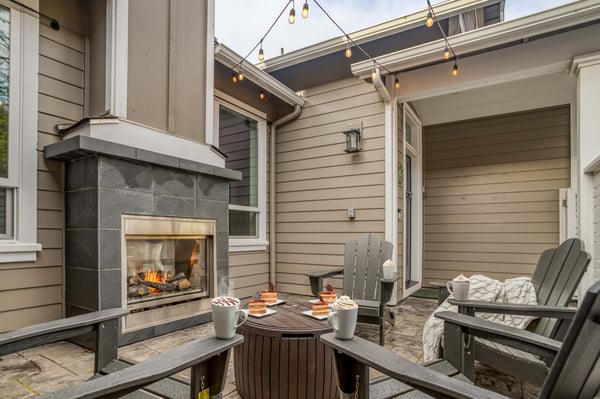 Front Patio with Fireplace and String Lights