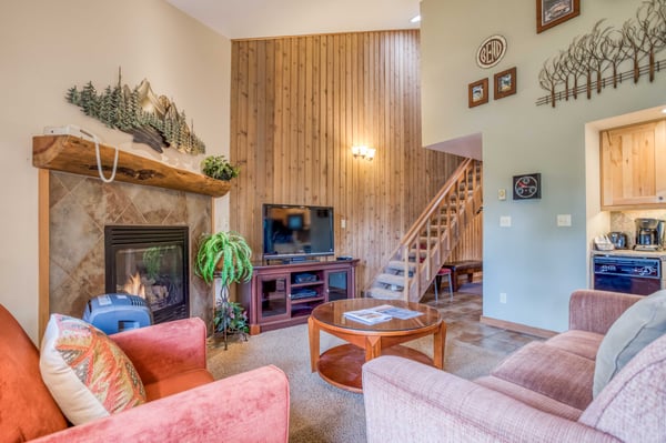 Living room with television & staircase